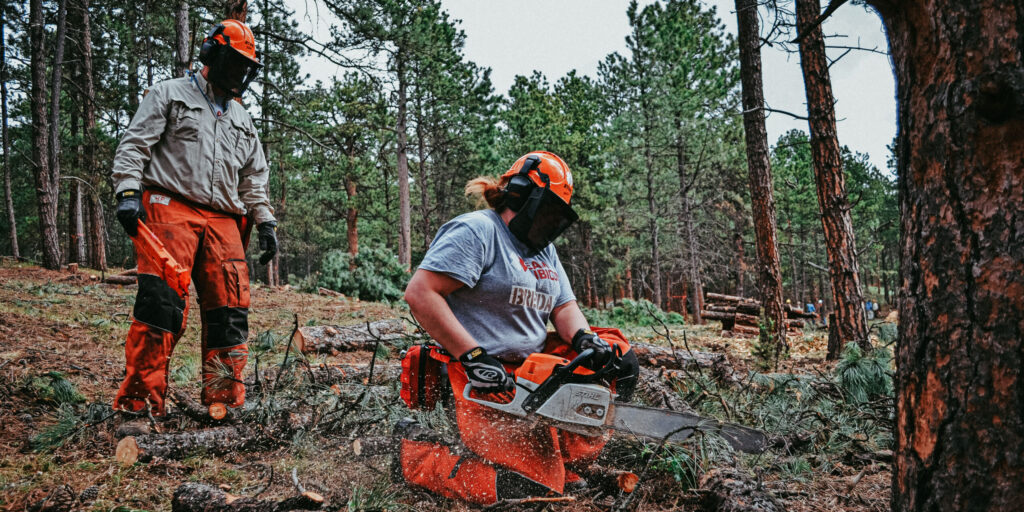 volunteers with disabilities working as sawyers.