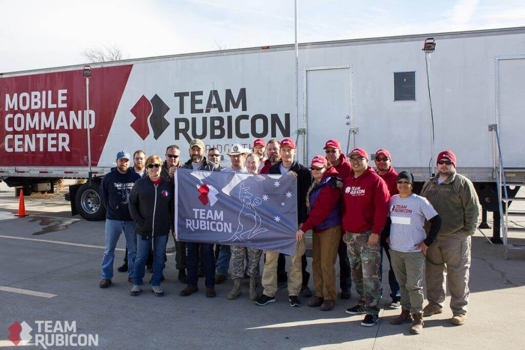 Members deployed in Texas presented Geoff with a TR Australia flag before he returned home. 