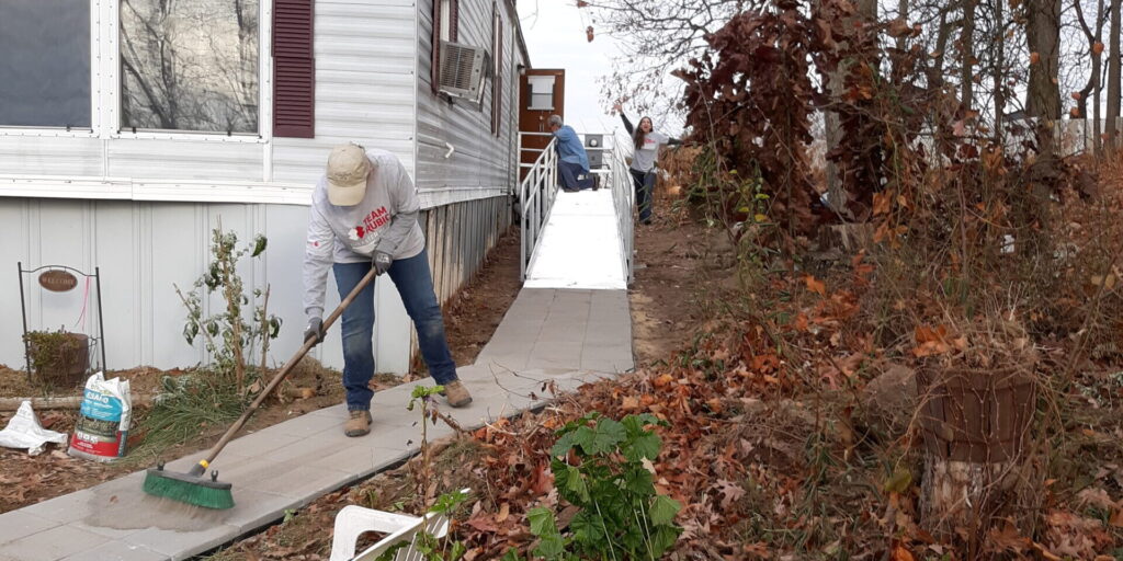 volunteer on cement path near new ramp