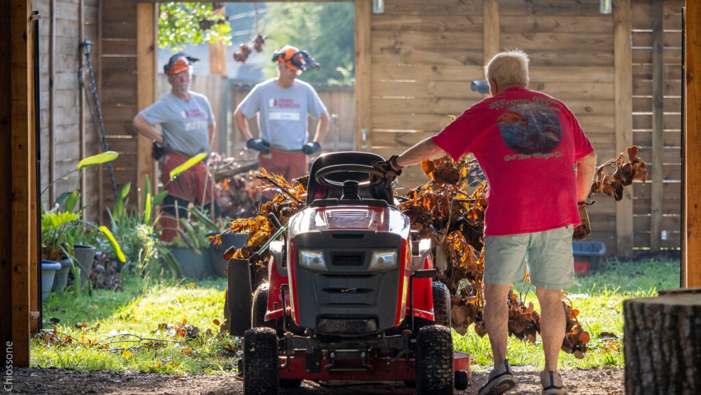 man with tractor loaded with debris demonstrates the heart work of disaster relief