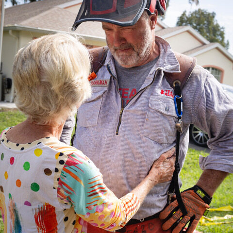 hurricane relief volunteer with hurricane Milton survivor.